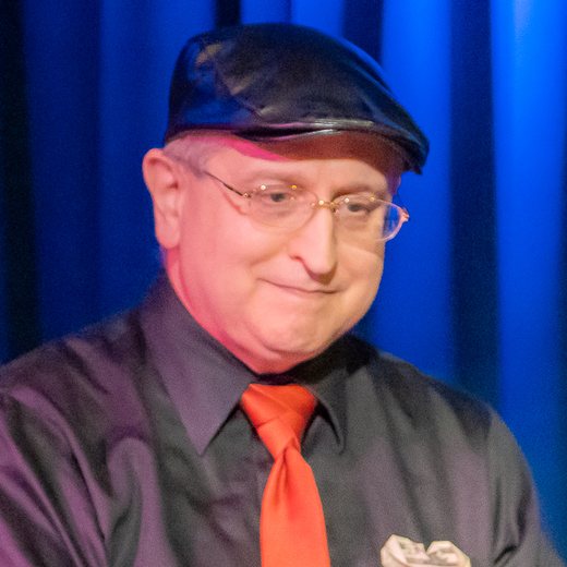 James King smiling at the keyboard during a performance